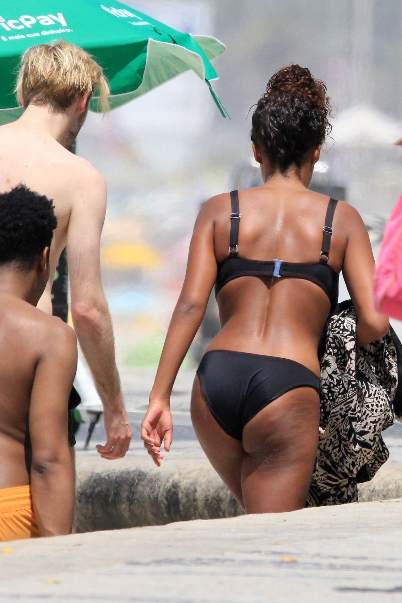 Tina Kunakey Enjoys The Rio Sunshine In A Sexy Black Bikini 0020