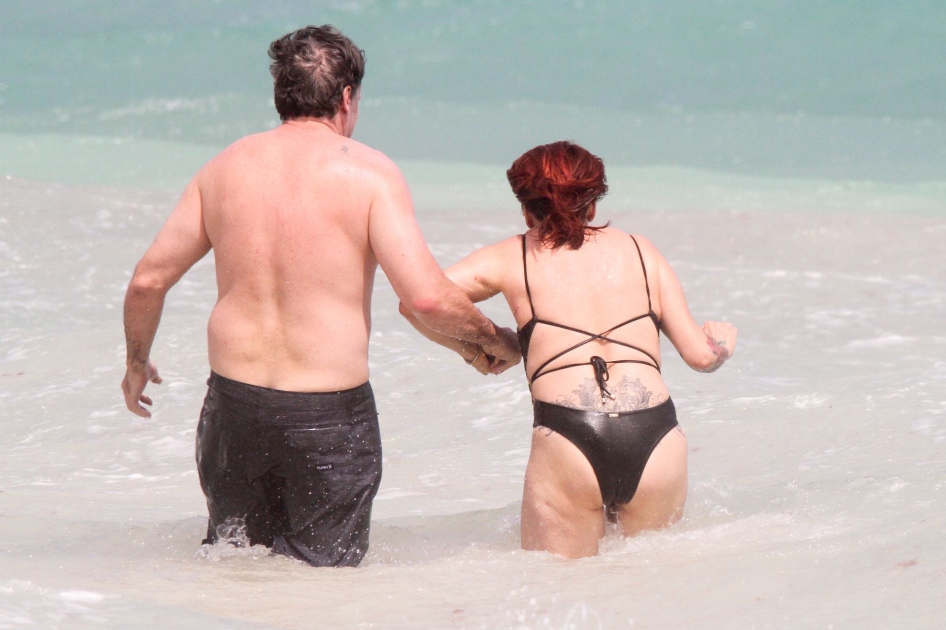 Slash’s Ex Wife Perla Ferrar Is Living Life On The Beach 0022